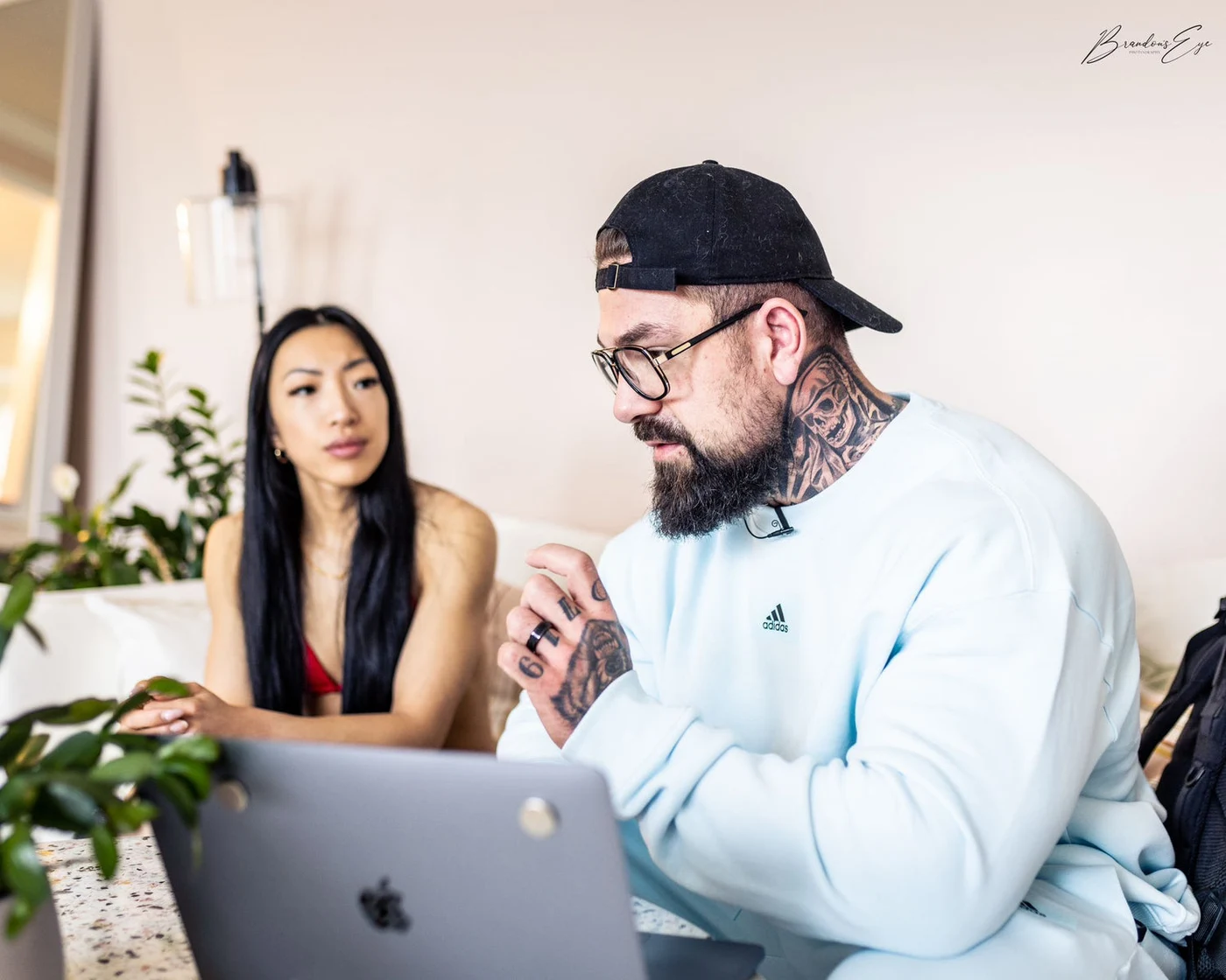 Trademark coaches review a plan together at a laptop